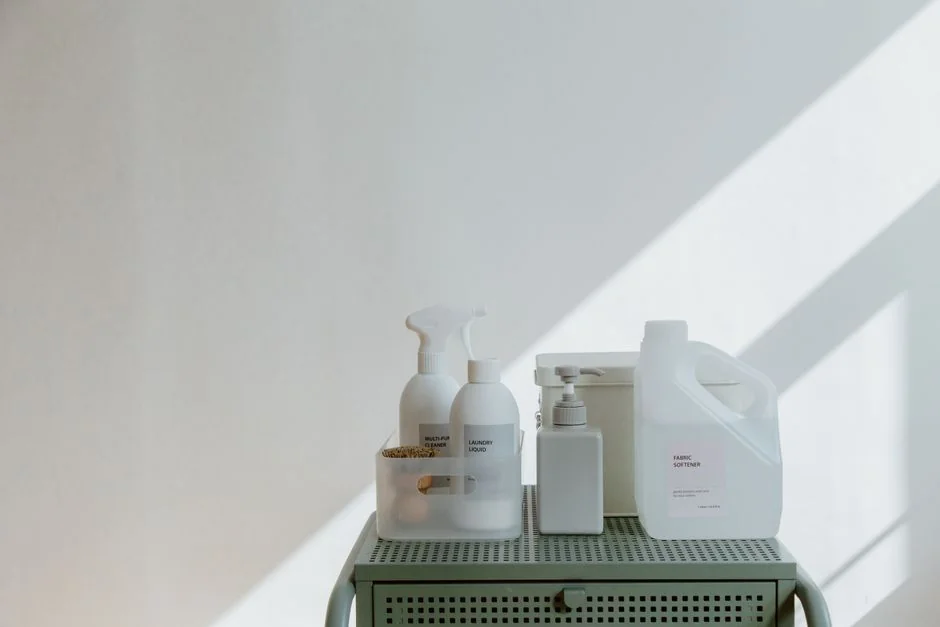 A housekeeper elegantly arranges bed sheets in a luxurious hotel room, showcasing hospitality expertise.